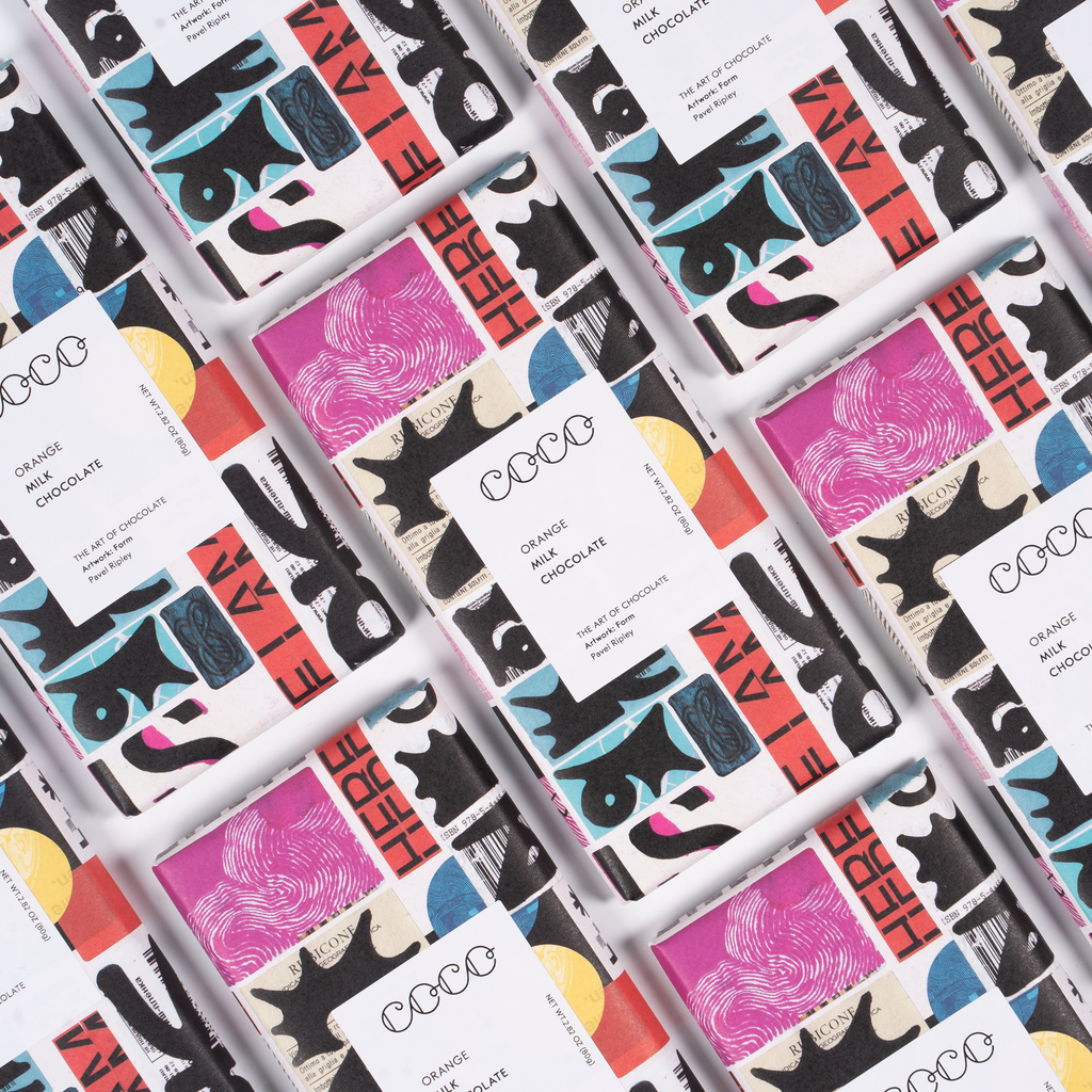 COCO Orange Milk Chocolate bar, close-up of packs laid out diagonally