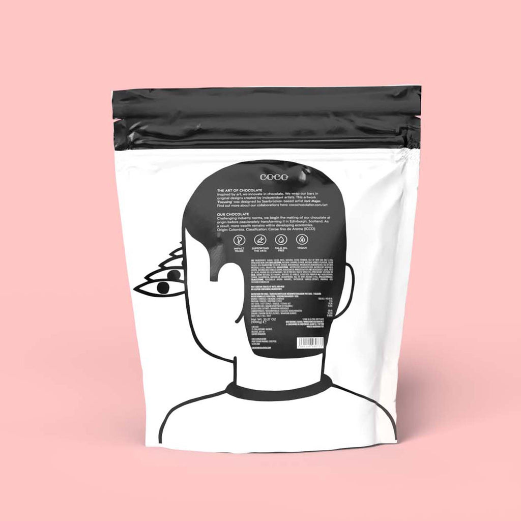 COCO Isle of Skye Salted Caramel Drinking Chocolate 1kg, back of pouch on a pink background