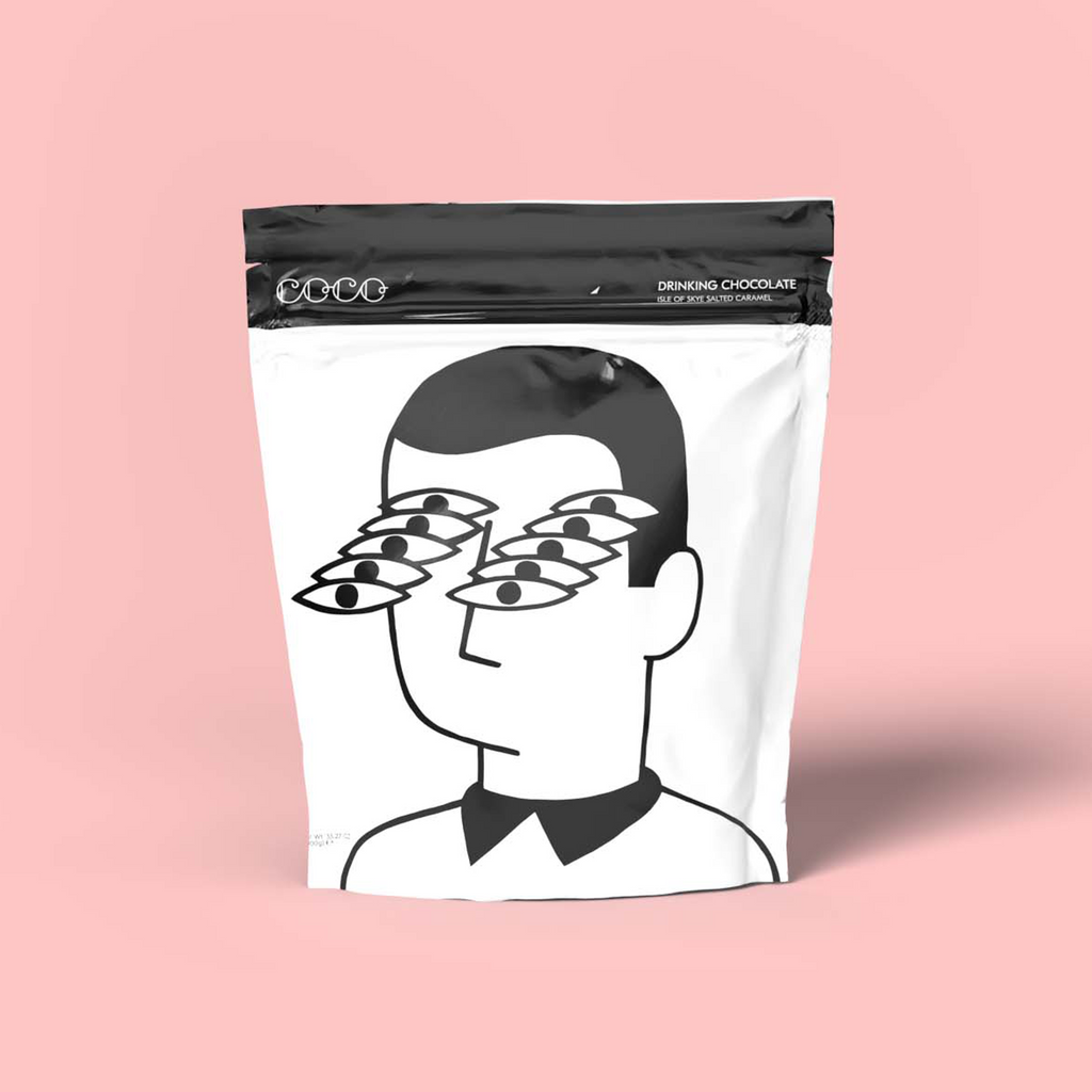 COCO Isle of Skye Salted Caramel Drinking Chocolate 1kg, front of pouch on a pink background