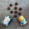 Love Cocoa Salted Caramel Milk Chocolate Truffles, open truffle tube with truffles scattered