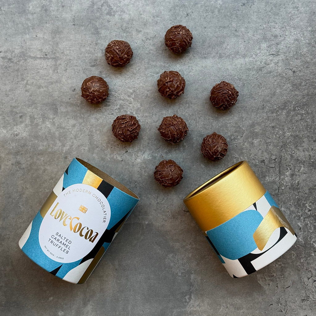 Love Cocoa Salted Caramel Milk Chocolate Truffles, open truffle tube with truffles scattered
