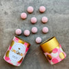 Love Cocoa Pink Gin White Chocolate Truffles, open truffle tube with pink truffles scattered
