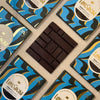 Love Cocoa Maldon Sea Salt Dark Chocolate Bar, unwrapped bar on a stack of packs