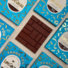 Love Cocoa Thank You Honeycomb Milk Chocolate Bar, unwrapped bar on a stack of Thank You packs
