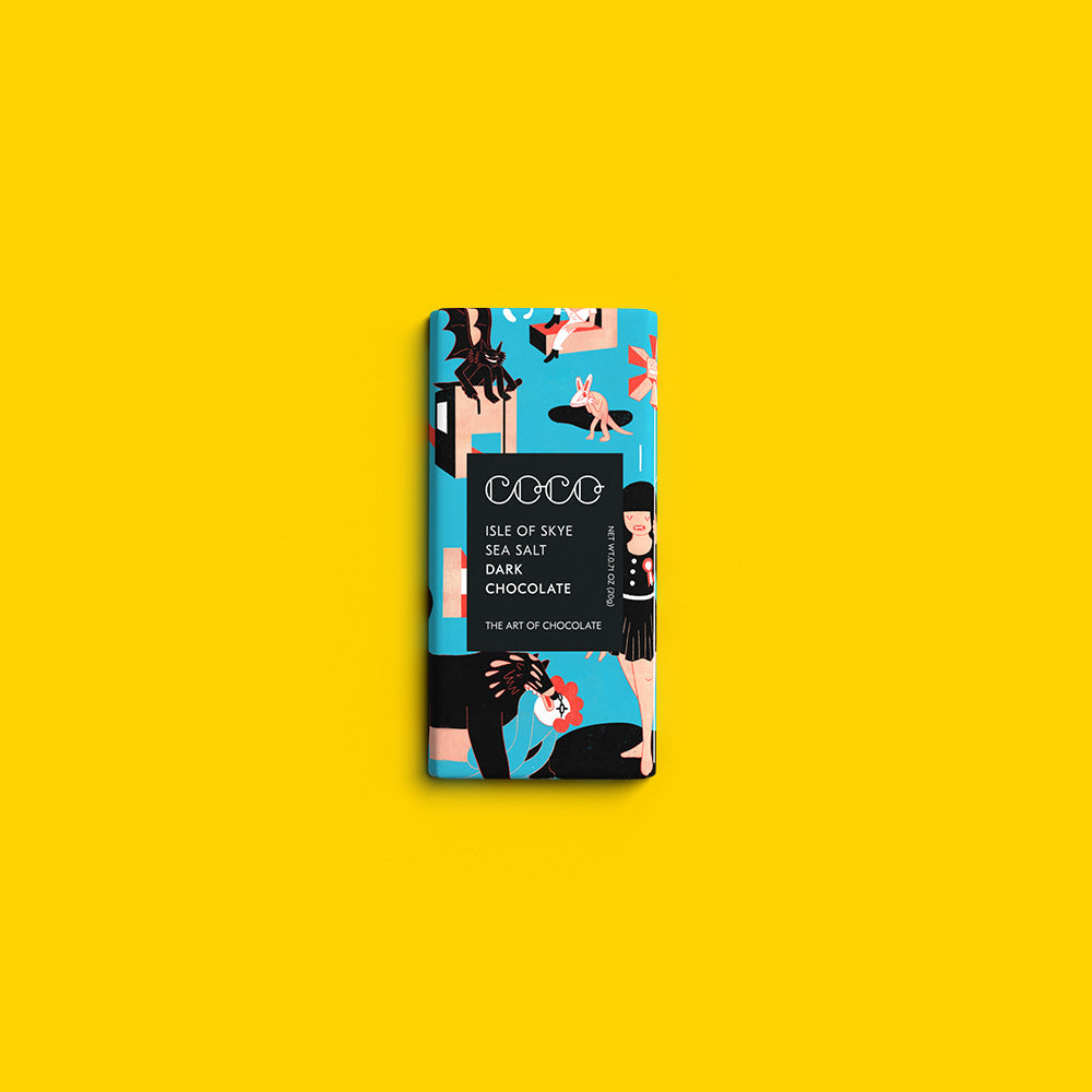 COCO Isle of Skye Sea Salt Dark mini bar, front of pack on a yellow background