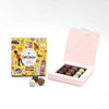 Love Cocoa London Petite Truffle Selection Box, London gift box beside an open box of truffles