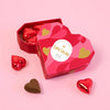 Love Cocoa Praline Milk Chocolate Truffles Heart Box, open heart-shaped box with foil-wrapped chocolate hearts