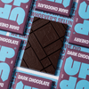 UP-UP Dark Cherry Dark Chocolate 120g, unwrapped dark bar on a stack of packs
