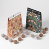COCO William Morris Sea Salt Caramel Truffles, two William Morris gift boxes with truffles scattered around