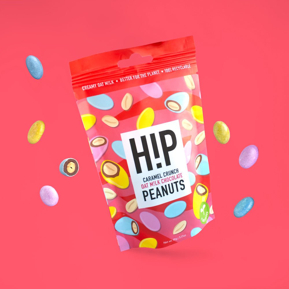 H!P Caramel Crunch Chocolate Peanuts, sharing pouch with coated peanuts on a red background