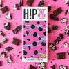 H!P Cookies NO Cream Oat M!lk Chocolate bar, wrapper with cookie pieces on a pink background