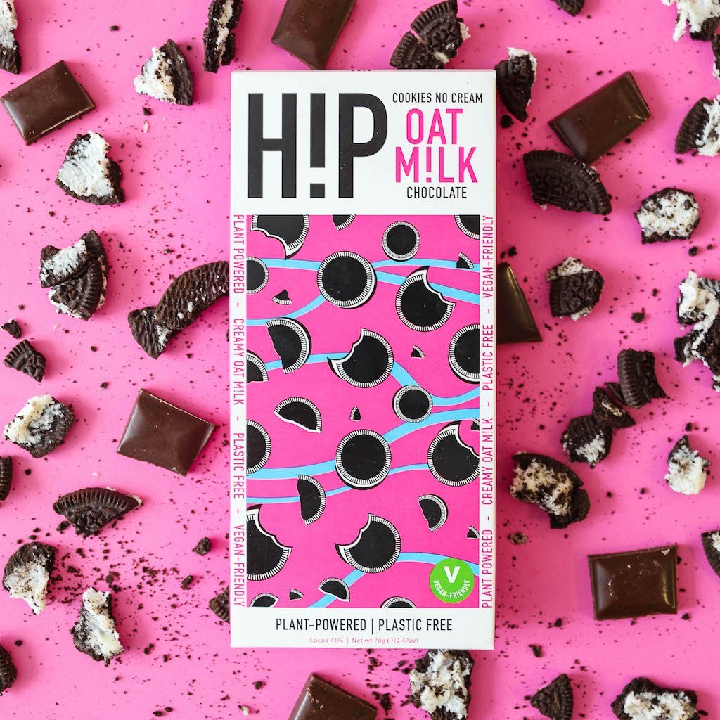 H!P Cookies NO Cream Oat M!lk Chocolate bar, wrapper with cookie pieces on a pink background
