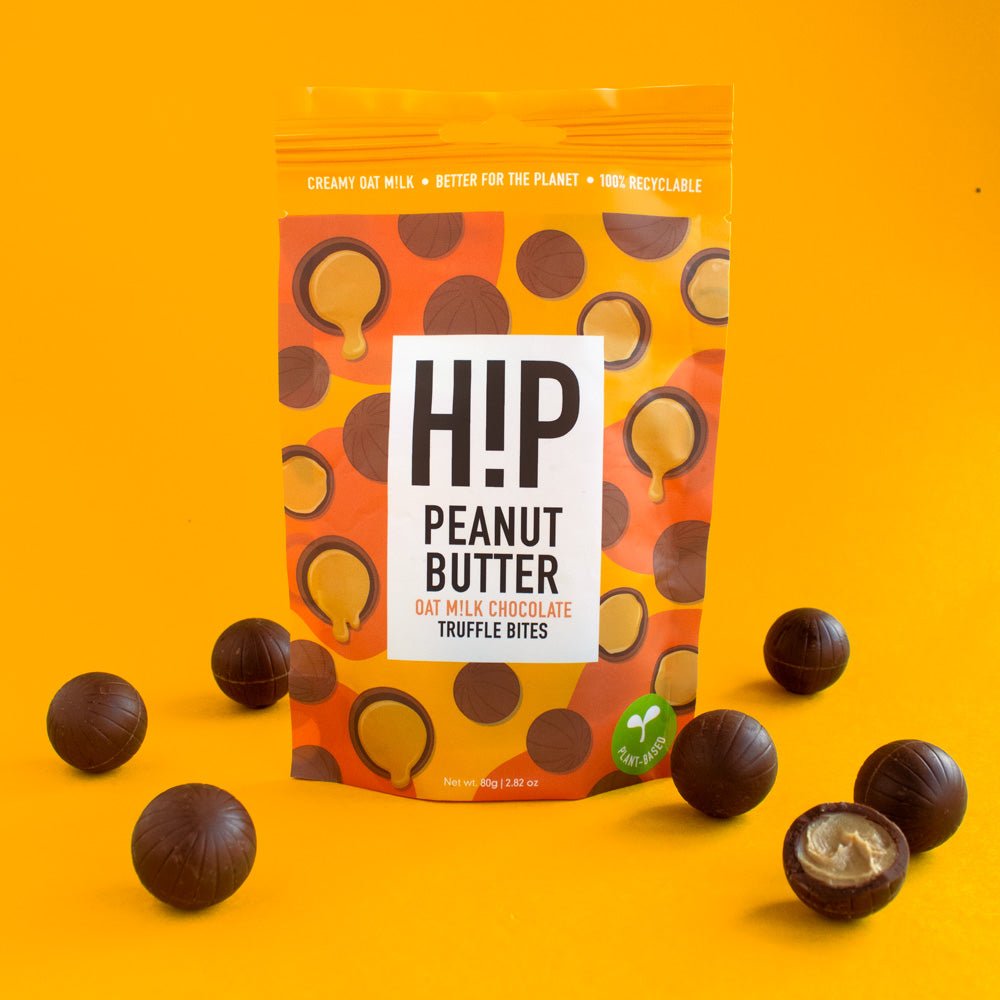 H!P Peanut Butter Chocolate Truffle Bites, sharing pouch with truffle bites on a yellow background