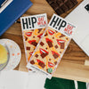 H!P Salted Caramel Oat M!lk Chocolate bar, two bars on a table with coffee