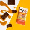 H!P Salted Caramel Oat M!lk Chocolate mini bar, wrapper with chocolate pieces and caramel drizzle