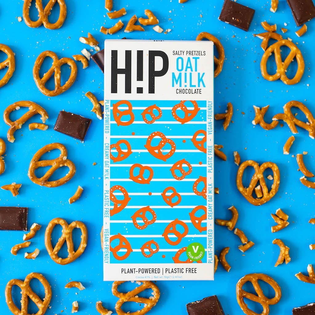 H!P Salty Pretzel Oat M!lk Chocolate bar, wrapper surrounded by pretzels on a blue background
