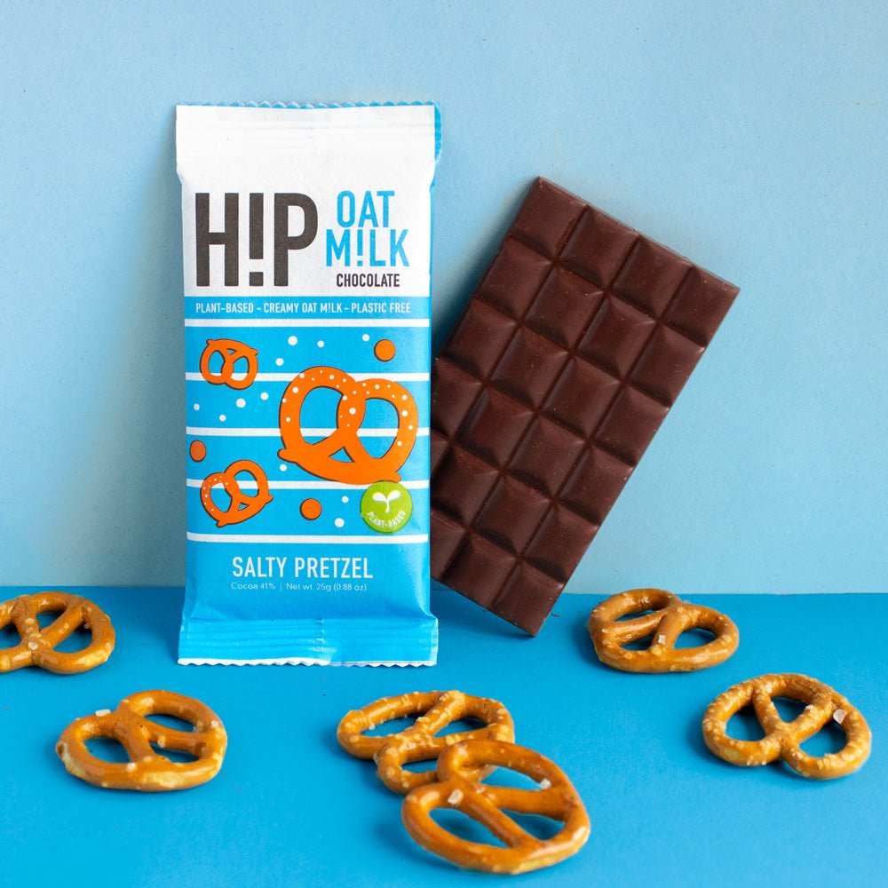 H!P Salty Pretzel Oat M!lk Chocolate mini bar, wrapper with a bar and pretzels on a blue background