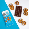 H!P Salty Pretzel Oat M!lk Chocolate mini bar, wrapper with a bar and pretzels